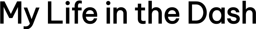 Silhouette of a man playing electric guitar.